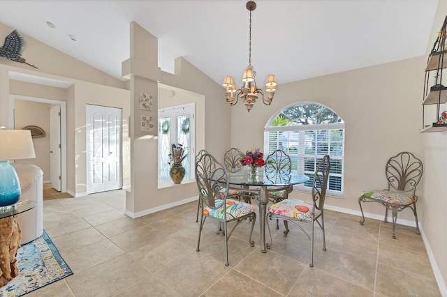 dining room with plenty of natural light, baseboards, an inviting chandelier, and vaulted ceiling