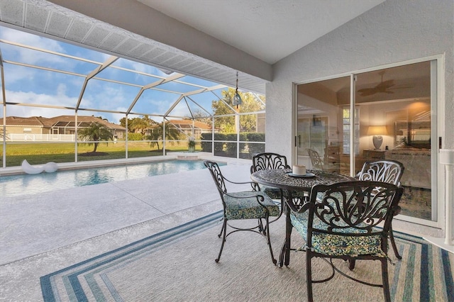 view of patio featuring an outdoor pool and a lanai