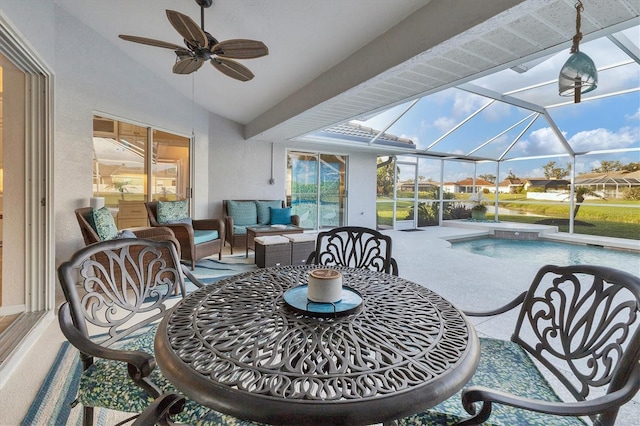 exterior space featuring a ceiling fan and lofted ceiling