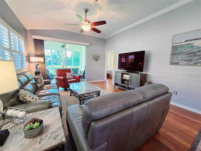 living room featuring ornamental molding, baseboards, a ceiling fan, and wood finished floors