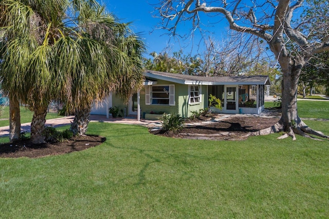 rear view of house with a yard