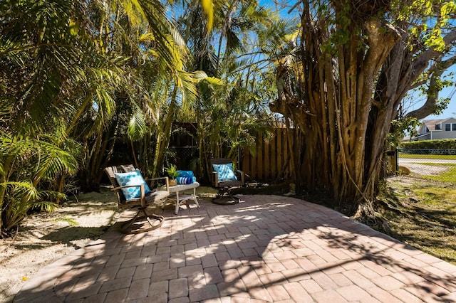 view of patio / terrace featuring fence