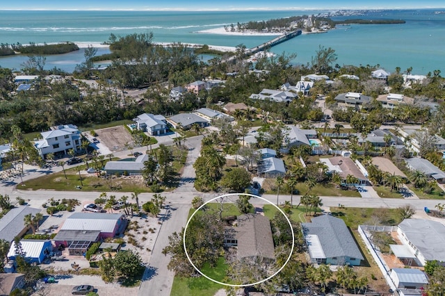 birds eye view of property with a water view and a residential view