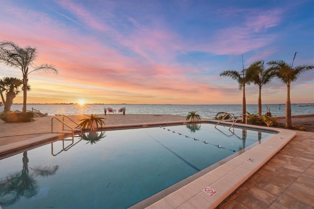 view of pool with a water view