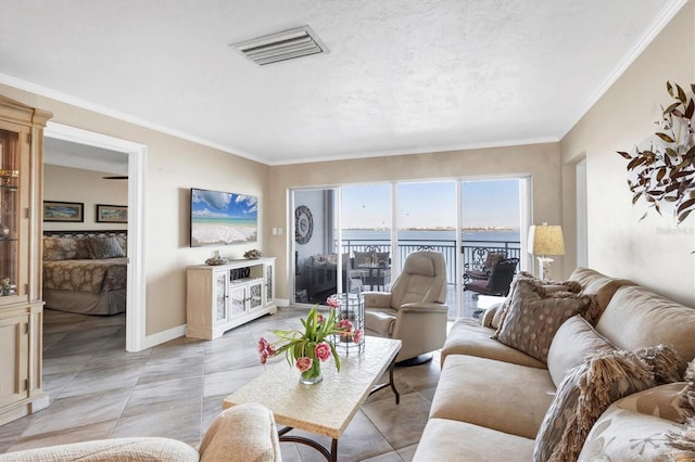 living room with light tile patterned floors, baseboards, visible vents, and ornamental molding