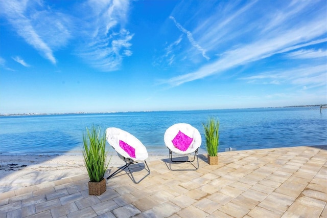 view of patio featuring a water view