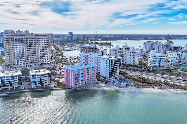 drone / aerial view with a city view and a water view