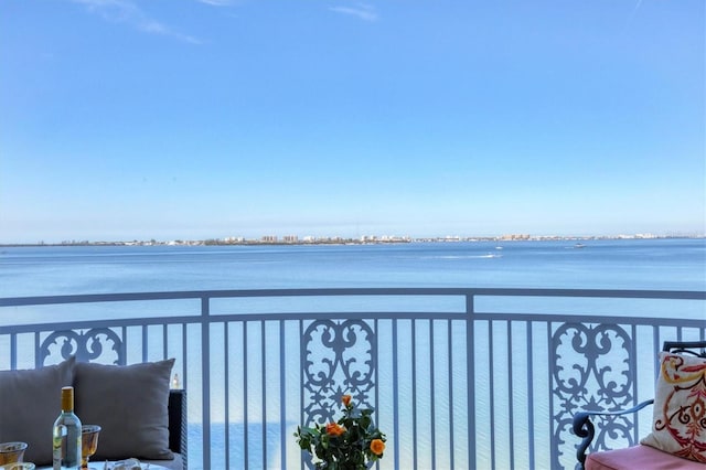 balcony featuring a water view