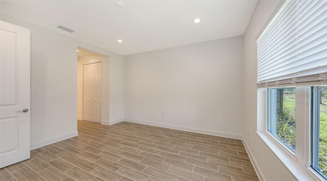empty room with recessed lighting, visible vents, baseboards, and light wood-style flooring