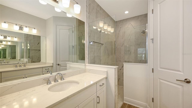 full bathroom featuring vanity and walk in shower