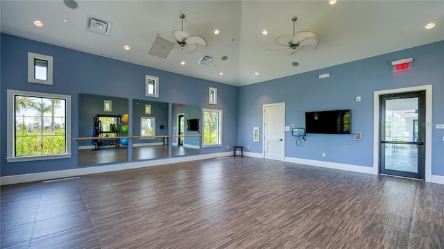 workout room with baseboards, visible vents, high vaulted ceiling, and a ceiling fan