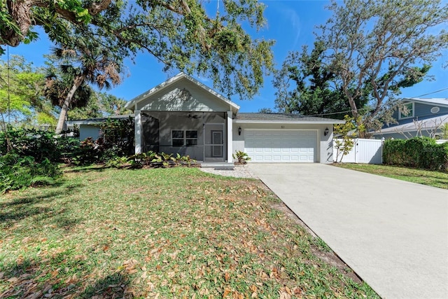 single story home featuring stucco siding, driveway, a front lawn, fence, and an attached garage