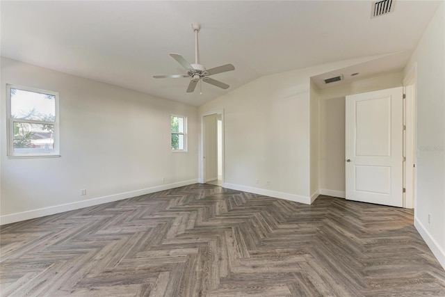 unfurnished room with vaulted ceiling, baseboards, visible vents, and ceiling fan