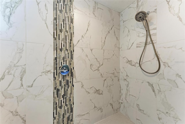 bathroom with tiled shower