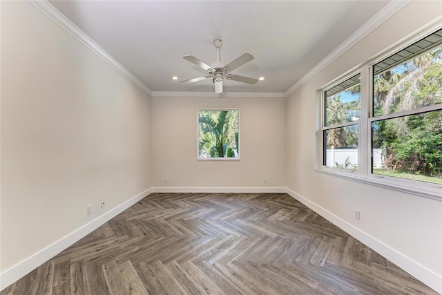 spare room with plenty of natural light, baseboards, and ornamental molding