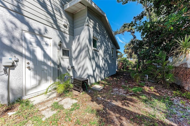 view of side of property featuring stucco siding