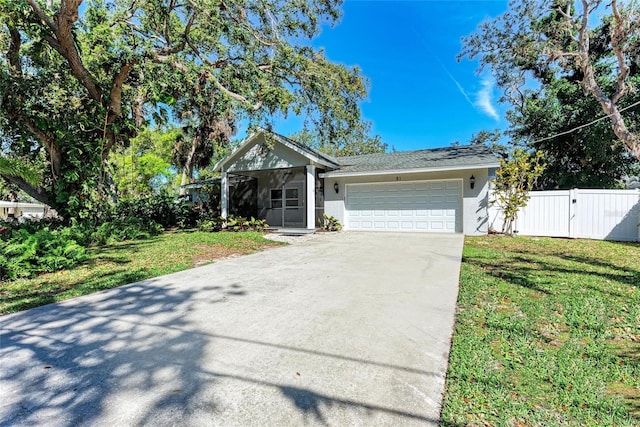 51 Webb St, Osprey, FL 34229 - ranch-style house with stucco siding, a garage, driveway, and a gate