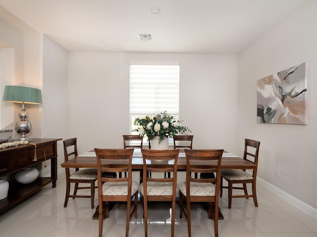 dining room with visible vents and baseboards