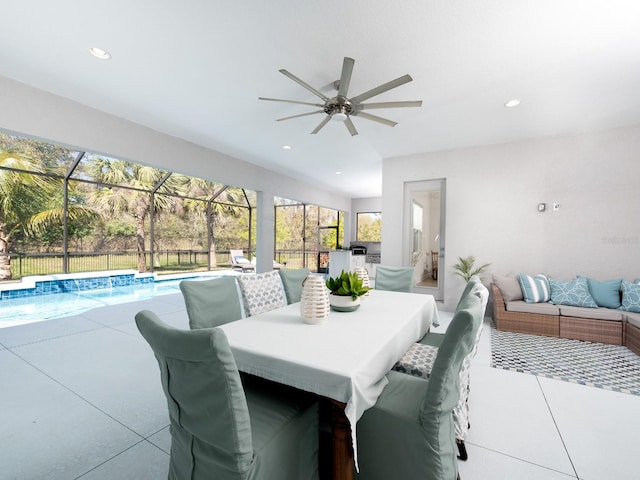 view of patio / terrace with fence, a ceiling fan, a fenced in pool, a lanai, and an outdoor hangout area