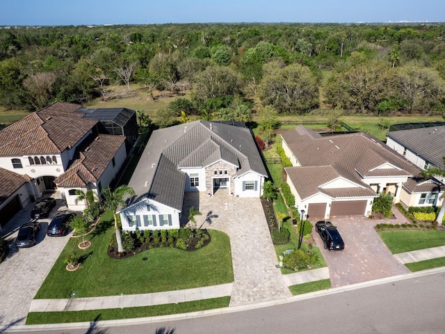 bird's eye view with a residential view and a view of trees