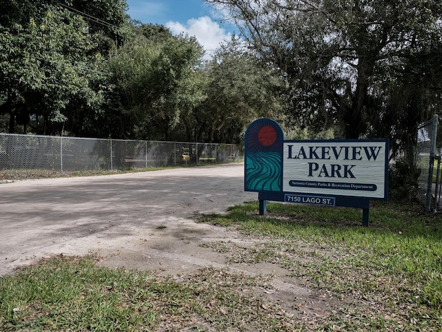 view of community featuring fence