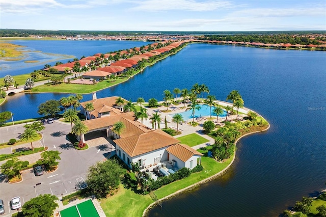 birds eye view of property with a water view