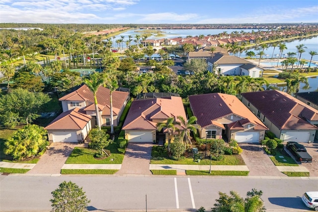 bird's eye view featuring a residential view and a water view