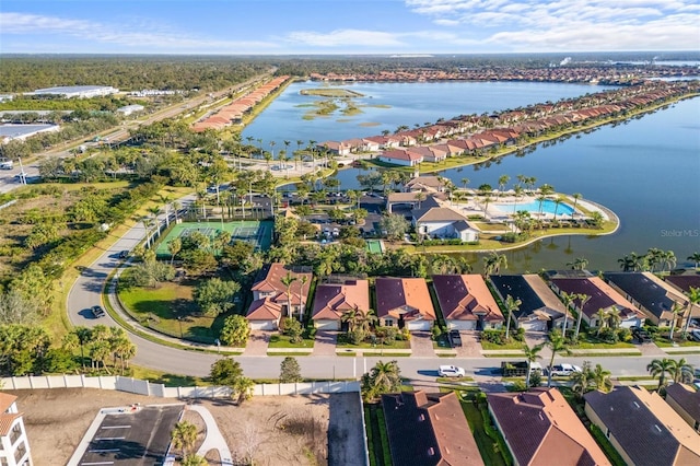 bird's eye view featuring a residential view and a water view