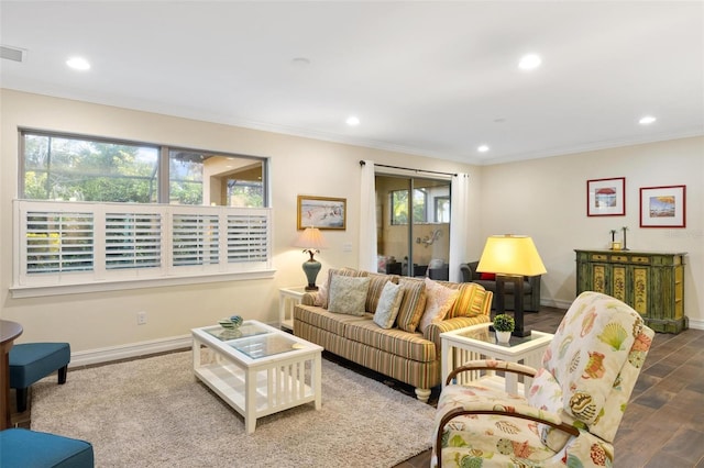 living area featuring recessed lighting, ornamental molding, baseboards, and wood finished floors