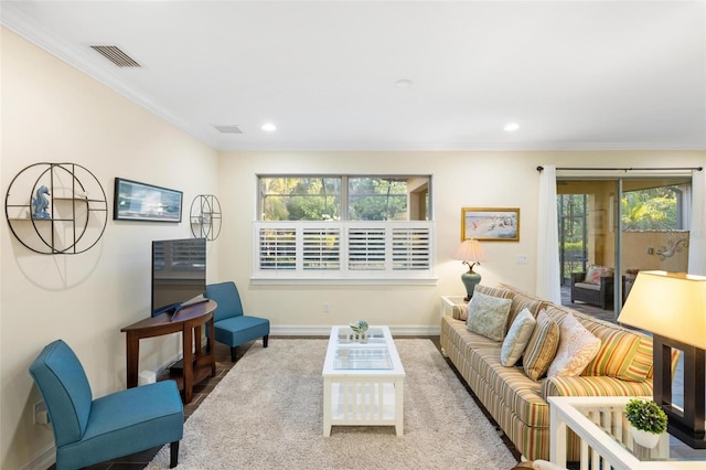 living area featuring visible vents, recessed lighting, crown molding, and baseboards