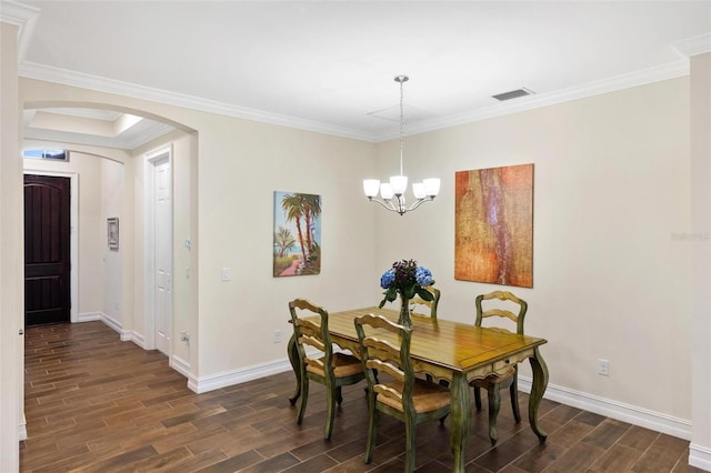 dining area featuring baseboards, visible vents, wood finish floors, arched walkways, and a notable chandelier