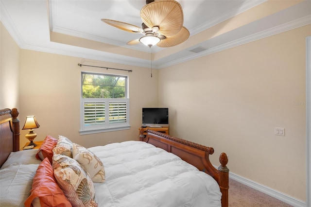 bedroom with visible vents, a tray ceiling, carpet, crown molding, and baseboards