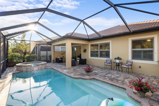 view of swimming pool featuring a patio and a pool with connected hot tub