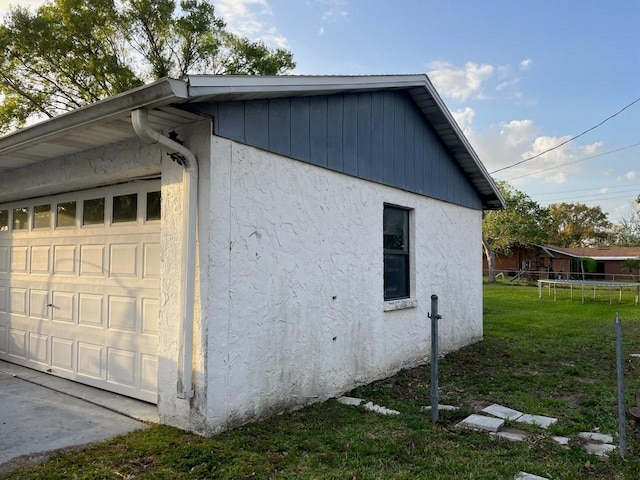 view of home's exterior with a yard and stucco siding