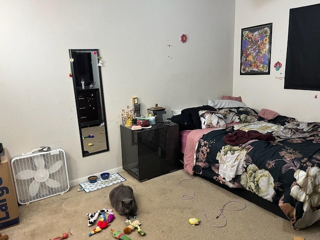 carpeted bedroom featuring baseboards