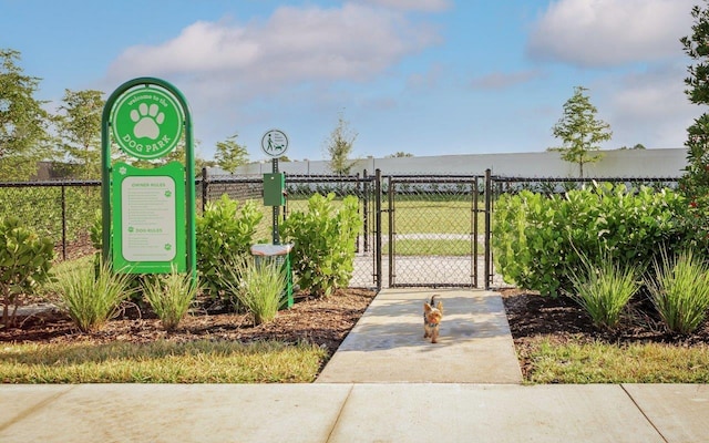 view of community featuring a gate and fence