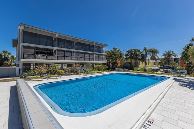 community pool featuring a patio area