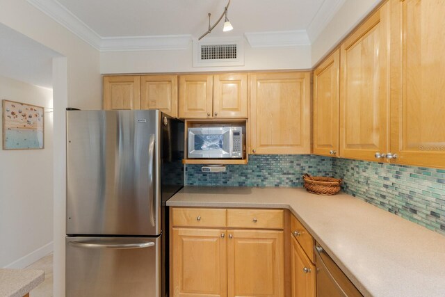 kitchen featuring decorative backsplash, visible vents, appliances with stainless steel finishes, and ornamental molding