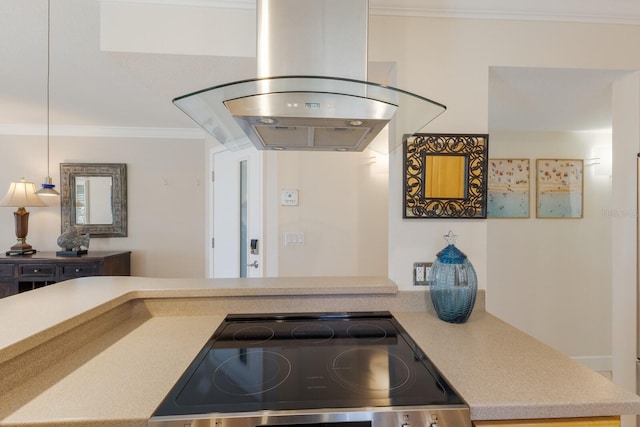 kitchen featuring electric range, ornamental molding, island range hood, and light countertops