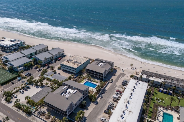 bird's eye view with a beach view and a water view