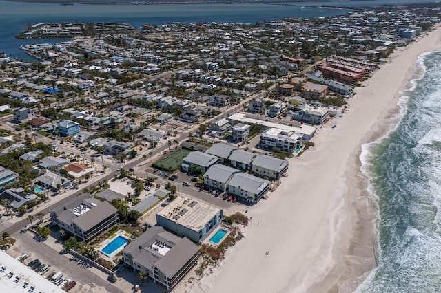 bird's eye view featuring a water view and a view of the beach