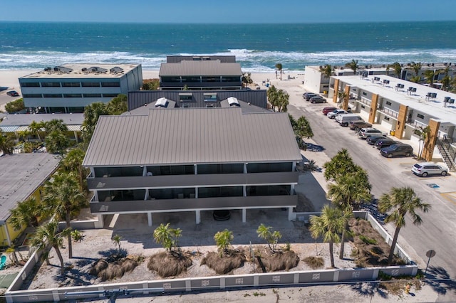 drone / aerial view with a view of the beach and a water view