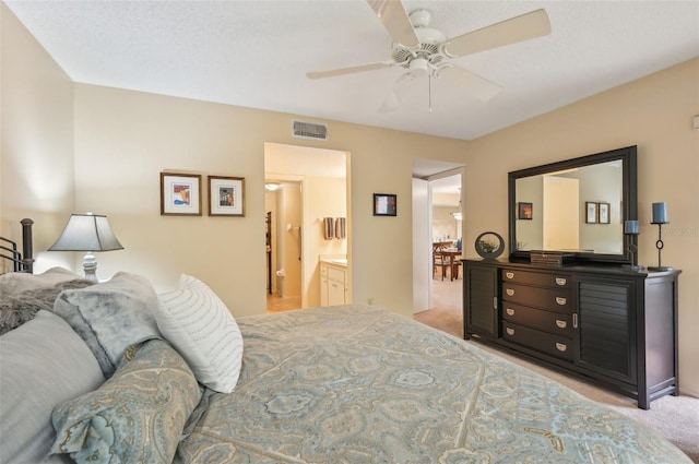 carpeted bedroom with visible vents and ceiling fan