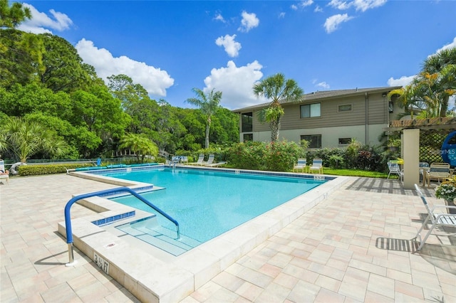 community pool featuring a patio area