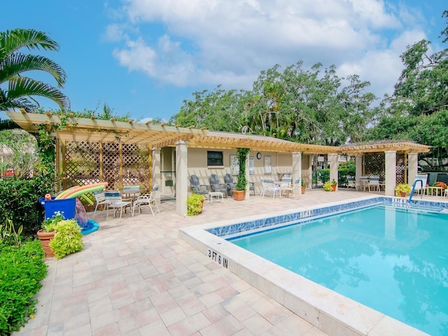 pool featuring a patio area and a pergola