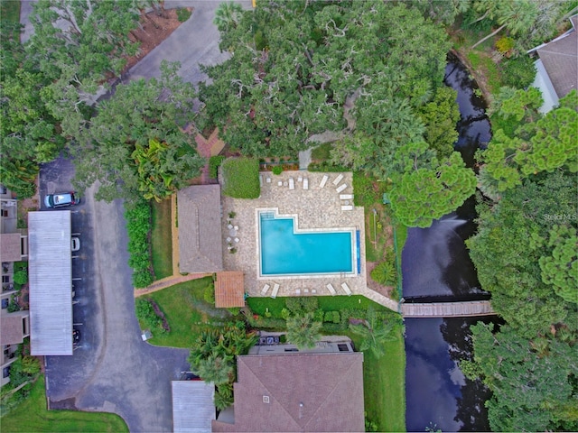 birds eye view of property with a water view