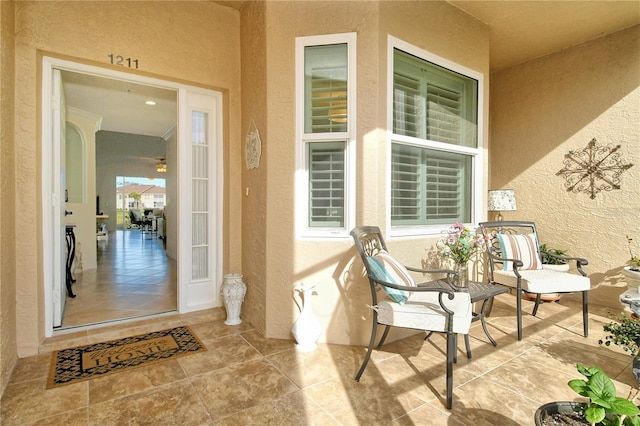 entrance to property with stucco siding