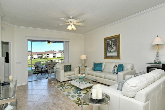 living room featuring light tile patterned floors, baseboards, ceiling fan, and crown molding