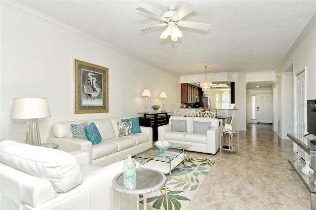 living area with light tile patterned floors, crown molding, and ceiling fan with notable chandelier