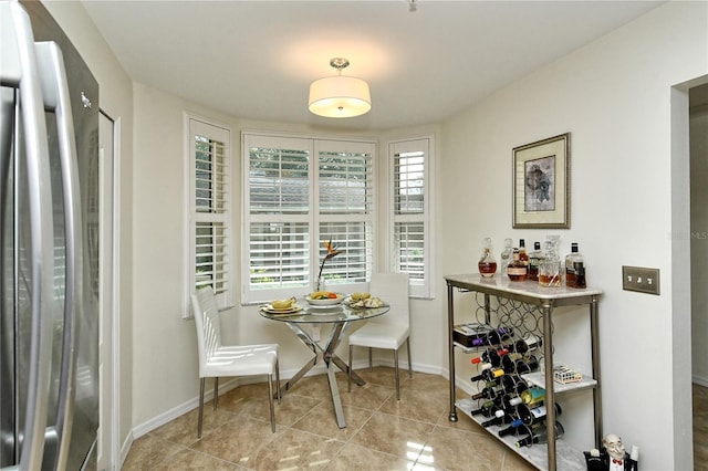 tiled dining space with baseboards